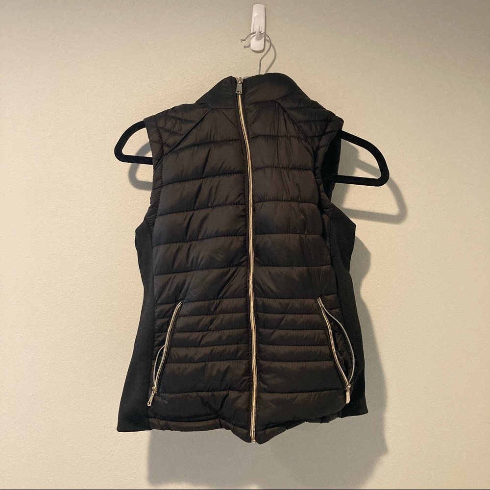 Black vest with removable hood